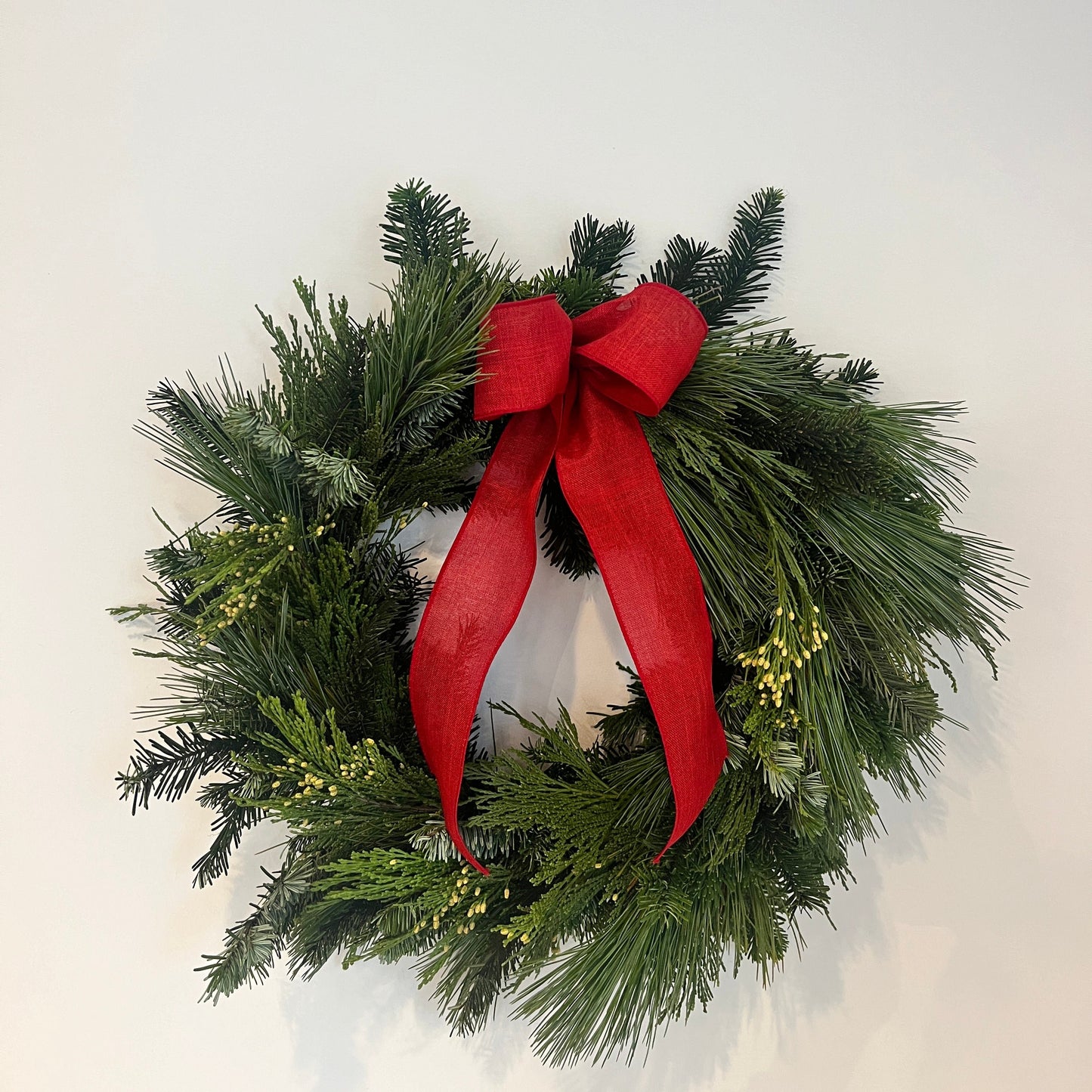 Mixed Greenery Wreath with Red Bow